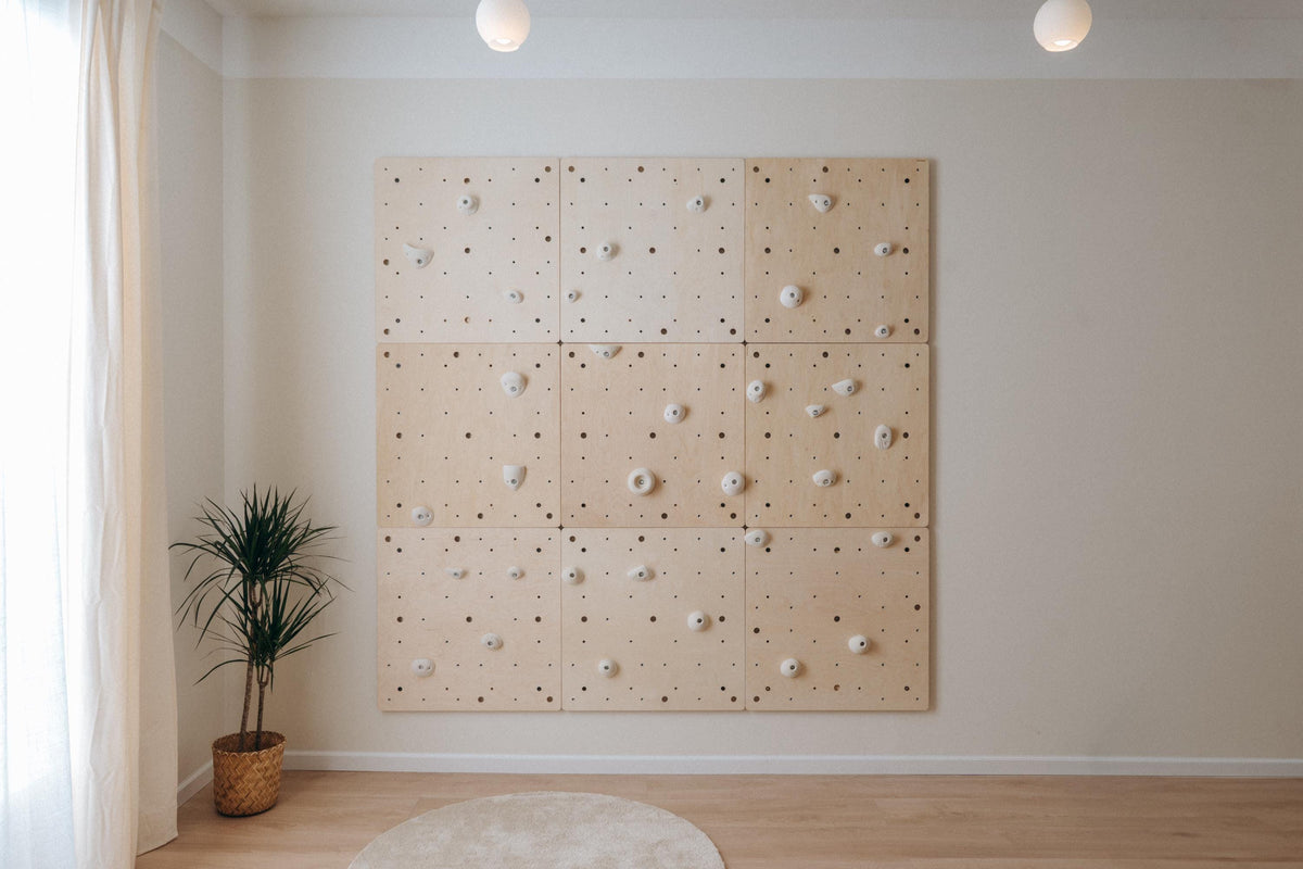 Large indoor climbing wall from nine square birch plywood panels