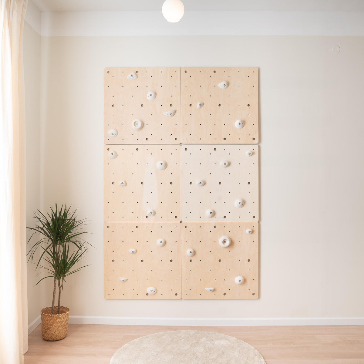 Climbing wall made of six square Climbsy panels