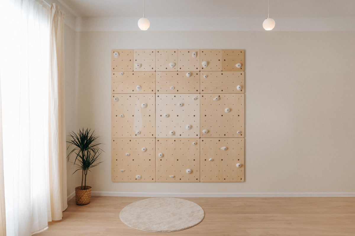 Square climbing wall made of multiple Climbsy panels