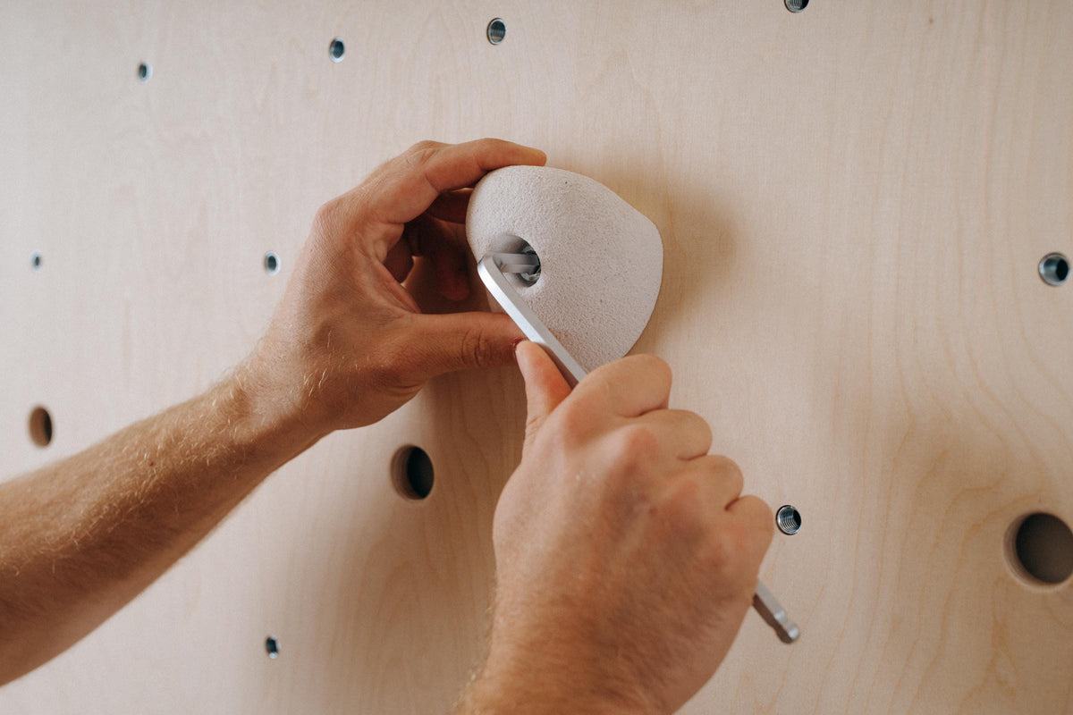 Attaching a climbing hold with an Allen key